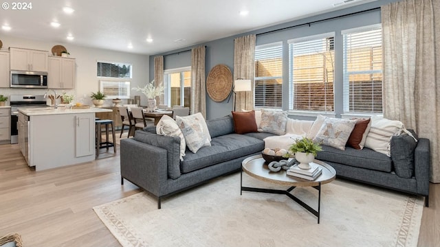 living room with light hardwood / wood-style floors