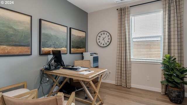 living room with light hardwood / wood-style floors