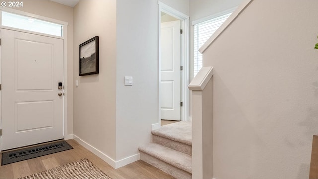 entryway with light hardwood / wood-style flooring