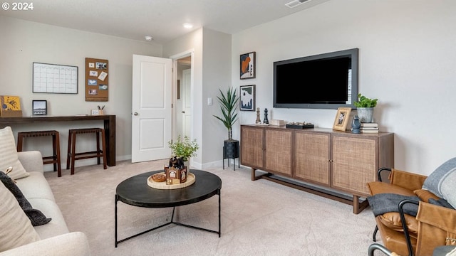 living room featuring light colored carpet