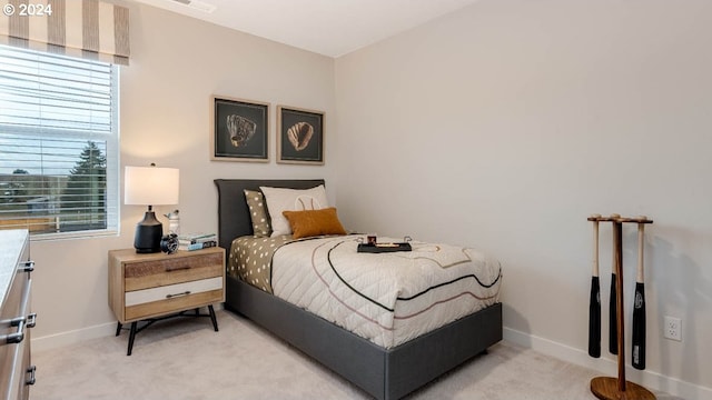 bedroom with light colored carpet