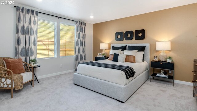 bedroom featuring a closet and light carpet