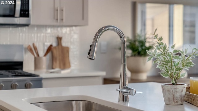 details with sink and white cabinetry