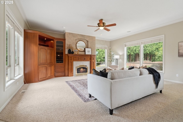 1508 NW 151st St, Vancouver, WA 98685 - living area with light carpet, a fireplace, a ceiling fan, and ornamental molding