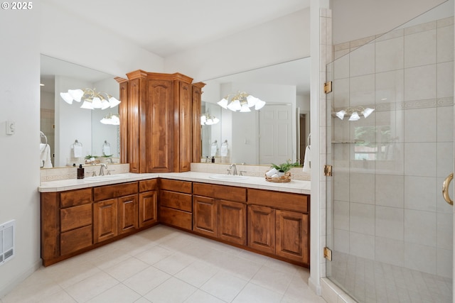 1508 NW 151st St, Vancouver, WA 98685 - full bath with a chandelier, double vanity, a shower stall, and tile patterned floors