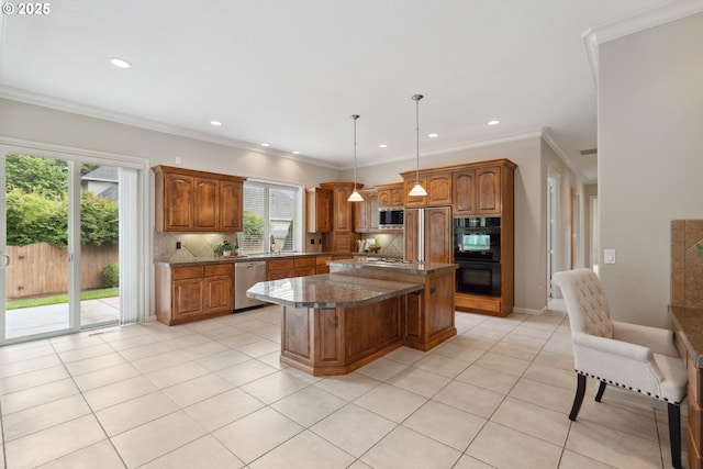 1508 NW 151st St, Vancouver, WA 98685 - kitchen with built in appliances, plenty of natural light, brown cabinets, recessed lighting, and crown molding