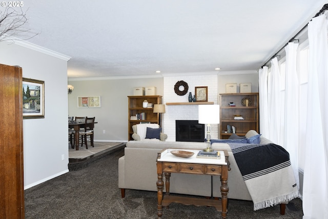 carpeted living area featuring baseboards, a fireplace, and crown molding