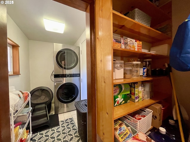 96343 Coos-Sumner Ln, Coos Bay, OR 97420 - laundry area with stacked washing machine and dryer and tile patterned floors