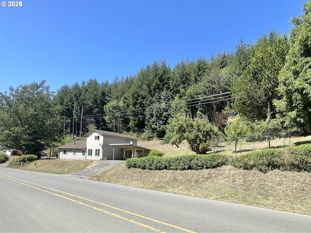 96343 Coos-Sumner Ln, Coos Bay, OR 97420 - view of front facade with driveway and an attached carport