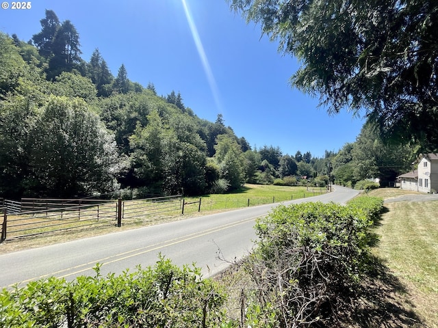 96343 Coos-Sumner Ln, Coos Bay, OR 97420 - view of asphalt street featuring a view of trees