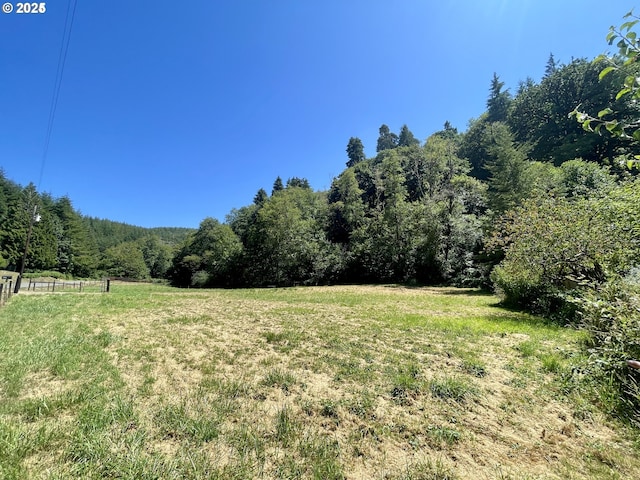 96343 Coos-Sumner Ln, Coos Bay, OR 97420 - view of green lawn with a wooded view and a view of countryside