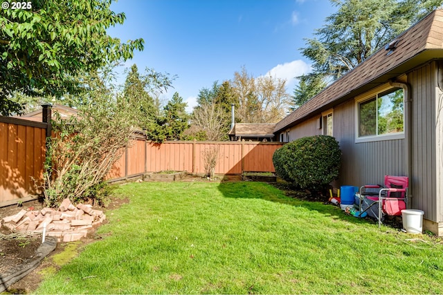 view of yard with a fenced backyard