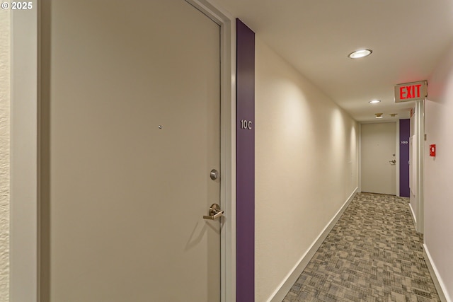 hall featuring carpet, baseboards, and recessed lighting