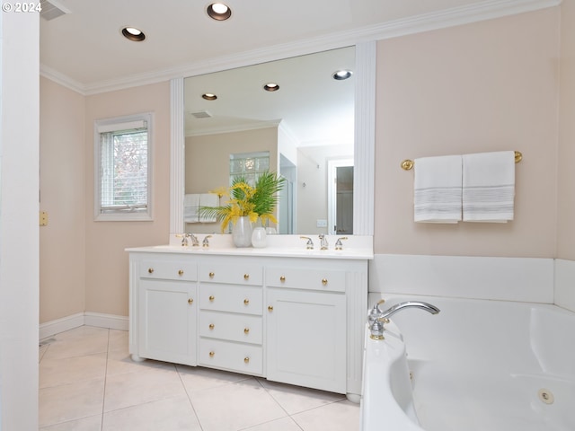 bathroom featuring vanity, tile patterned floors, ornamental molding, and a tub