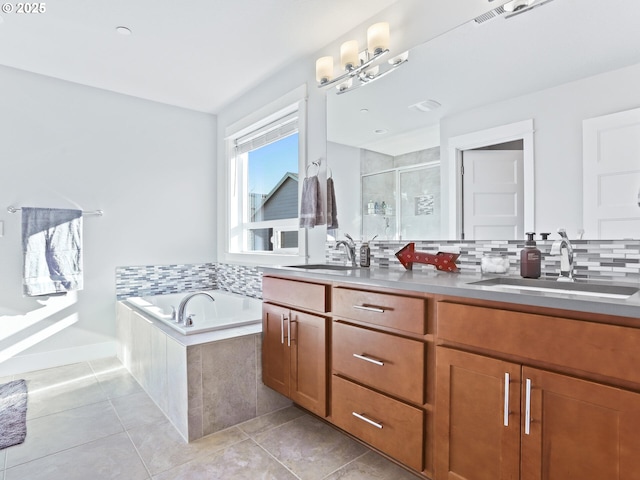 bathroom with tile patterned flooring, vanity, shower with separate bathtub, and decorative backsplash