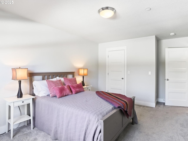 bedroom with light carpet