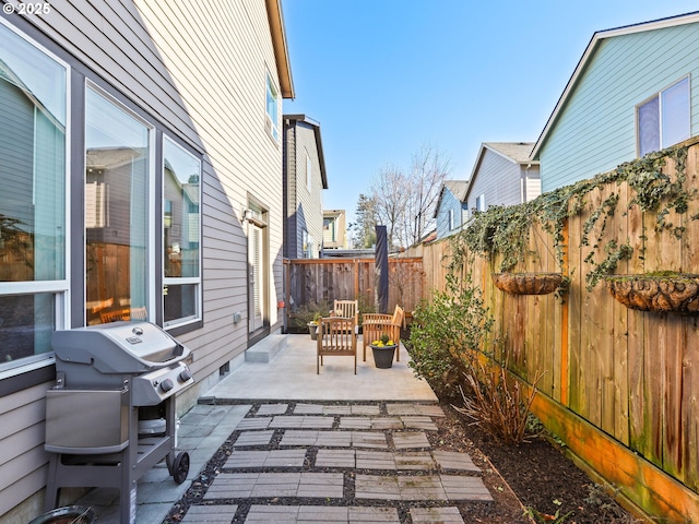 view of patio featuring a grill