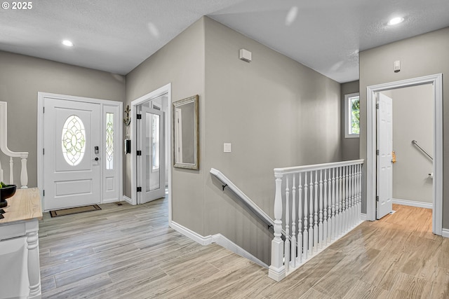 2672 SE Vista Way, Gresham, OR 97080 - entryway with light wood-type flooring, baseboards, recessed lighting, and a textured ceiling