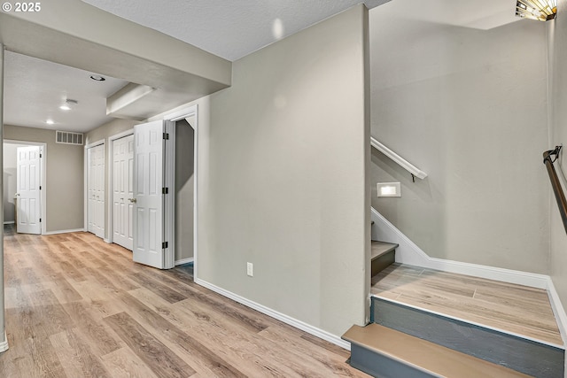 2672 SE Vista Way, Gresham, OR 97080 - below grade area with baseboards, stairway, light wood finished floors, and recessed lighting