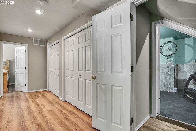 2672 SE Vista Way, Gresham, OR 97080 - hall featuring light wood finished floors, baseboards, recessed lighting, and a textured ceiling