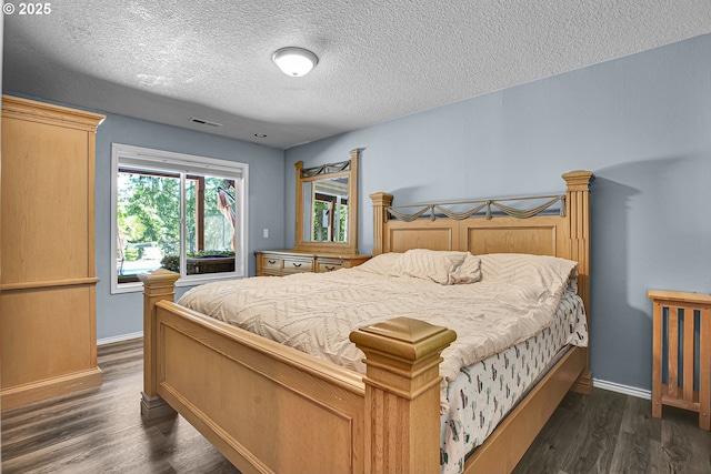 2672 SE Vista Way, Gresham, OR 97080 - bedroom with a textured ceiling, dark wood-style floors, and baseboards