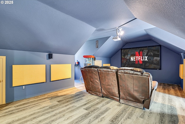 2672 SE Vista Way, Gresham, OR 97080 - cinema featuring wood finished floors, a textured ceiling, and vaulted ceiling