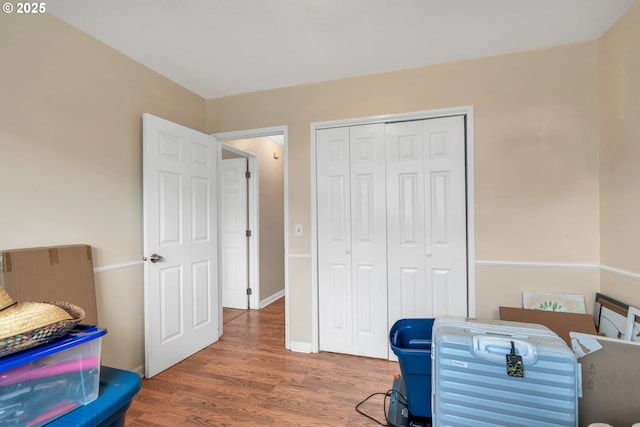 office with baseboards and wood finished floors