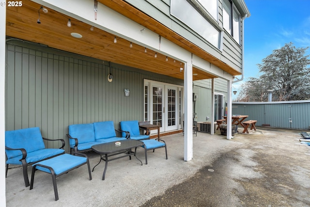 view of patio with french doors and an outdoor living space