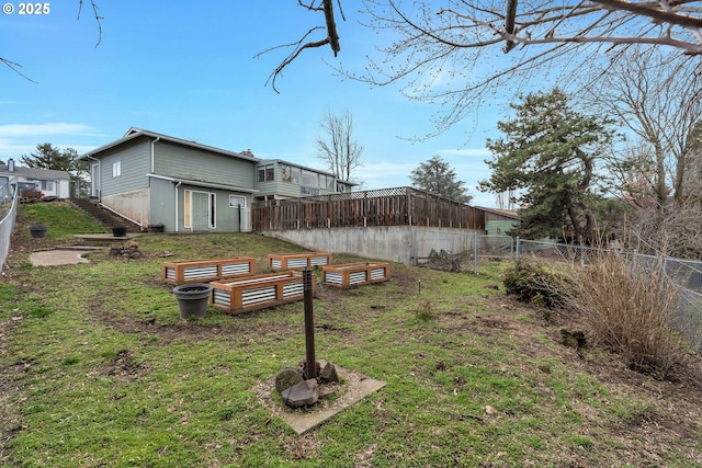 view of yard featuring a garden and fence