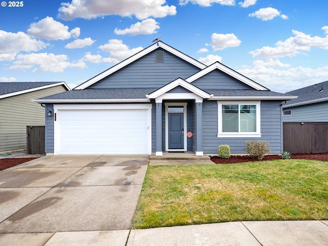 single story home with concrete driveway, an attached garage, and roof with shingles