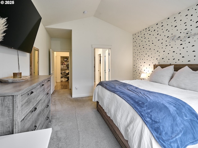 carpeted bedroom featuring lofted ceiling