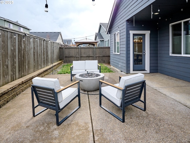 view of patio / terrace featuring an outdoor living space with a fire pit