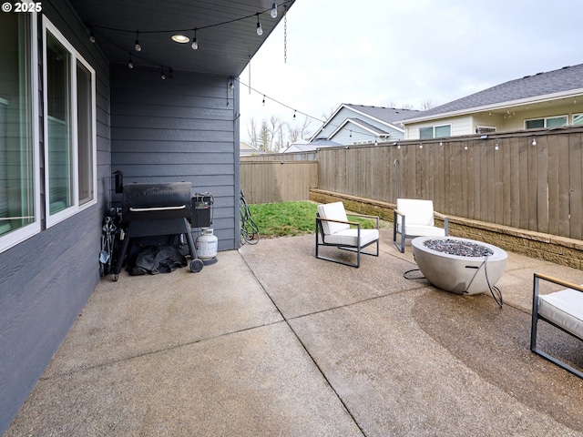 view of patio / terrace with a grill and an outdoor fire pit