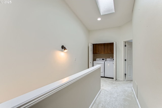 10372 NW Forestview Way, Portland, OR 97229 - corridor featuring washing machine and clothes dryer, light colored carpet, recessed lighting, baseboards, and a skylight