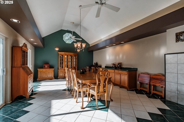 tiled dining area featuring lofted ceiling and ceiling fan with notable chandelier