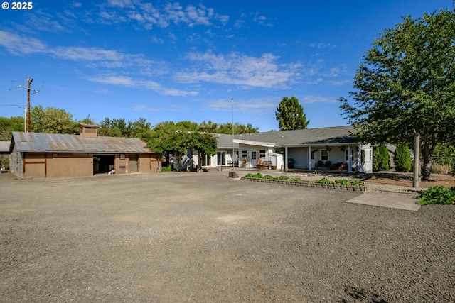 ranch-style house with a patio