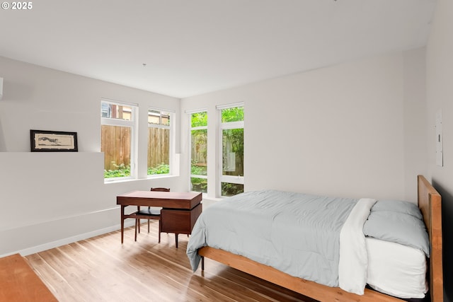 2021 SE Clinton St Unit 103, Portland, OR 97202 - bedroom featuring wood finished floors and baseboards