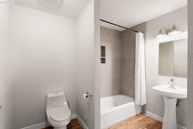 2021 SE Clinton St Unit 103, Portland, OR 97202 - full bath with shower / bath combo and wood finished floors