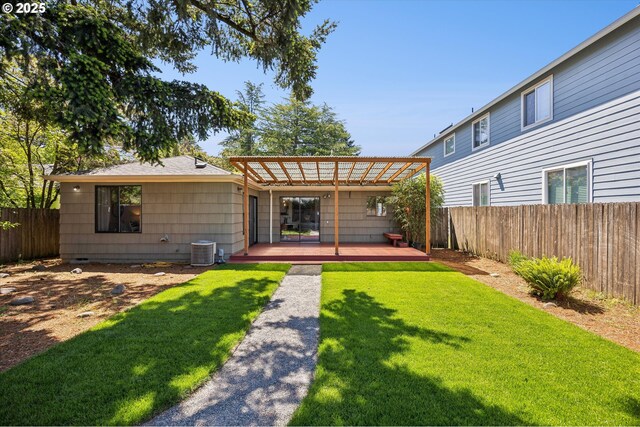 back of property with a pergola and a deck