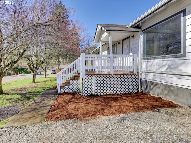 view of side of home with covered porch