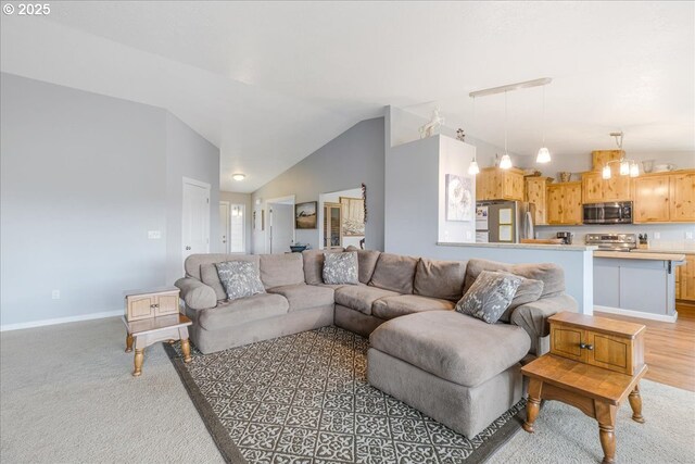 21600 NE Forest Dr, Yamhill, OR 97148 - living area featuring vaulted ceiling, baseboards, and light colored carpet