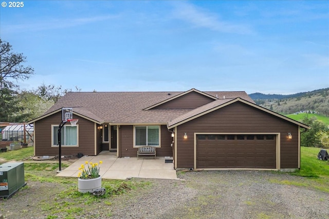 21600 NE Forest Dr, Yamhill, OR 97148 - view of front facade featuring an attached garage, roof with shingles, and gravel driveway