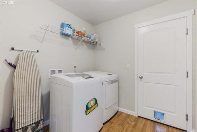 21600 NE Forest Dr, Yamhill, OR 97148 - laundry area with washer and dryer, light wood-style floors, and baseboards
