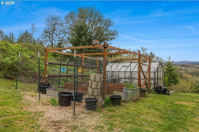 21600 NE Forest Dr, Yamhill, OR 97148 - view of grassy yard featuring a greenhouse and an outdoor structure