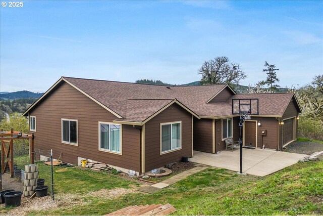 21600 NE Forest Dr, Yamhill, OR 97148 - rear view of house with a shingled roof, a yard, and a patio