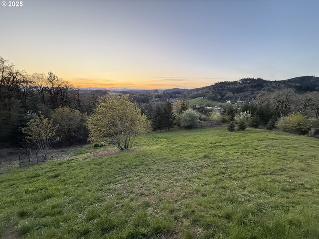 21600 NE Forest Dr, Yamhill, OR 97148 - deck at dusk featuring an outdoor fire pit