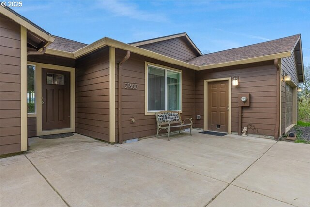 21600 NE Forest Dr, Yamhill, OR 97148 - view of front facade with a shingled roof, a patio area, and a front yard
