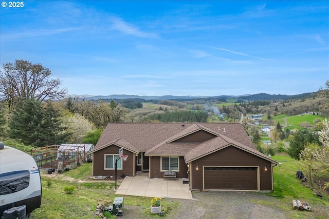 21600 NE Forest Dr, Yamhill, OR 97148 - ranch-style home with roof with shingles, an attached garage, a mountain view, and driveway