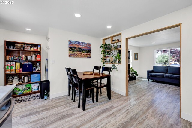 dining area featuring light wood-type flooring, recessed lighting, and baseboards