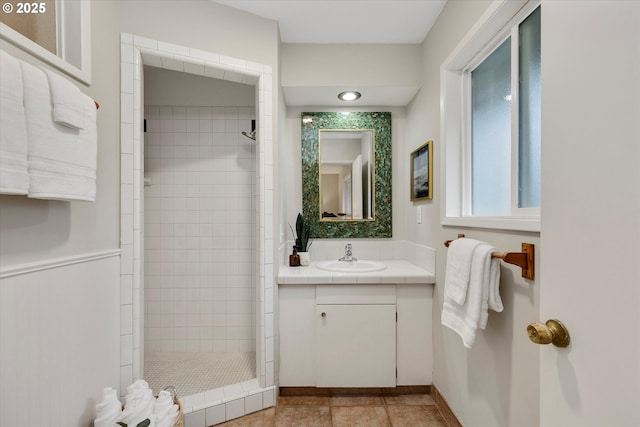 bathroom featuring vanity and a tile shower